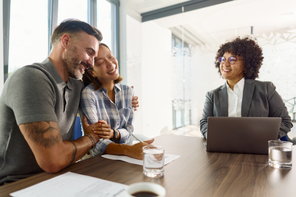 happy couple meeting with a financial advisor