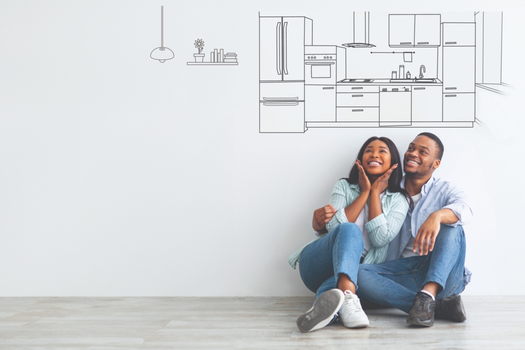 couple in blue jeans sitting on the floor