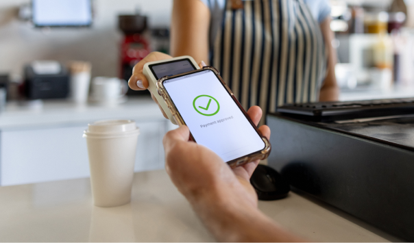 customer buying coffee with digital credit card