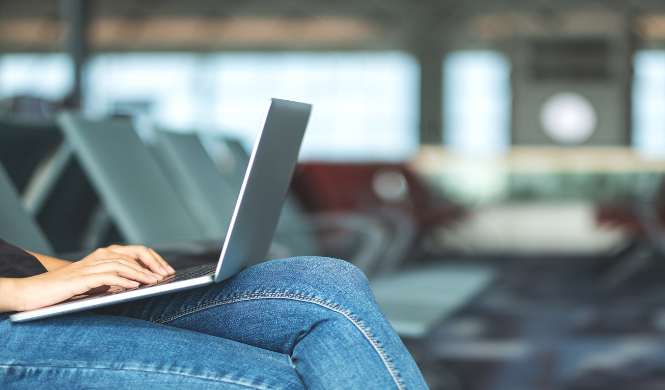 person typing on laptop
