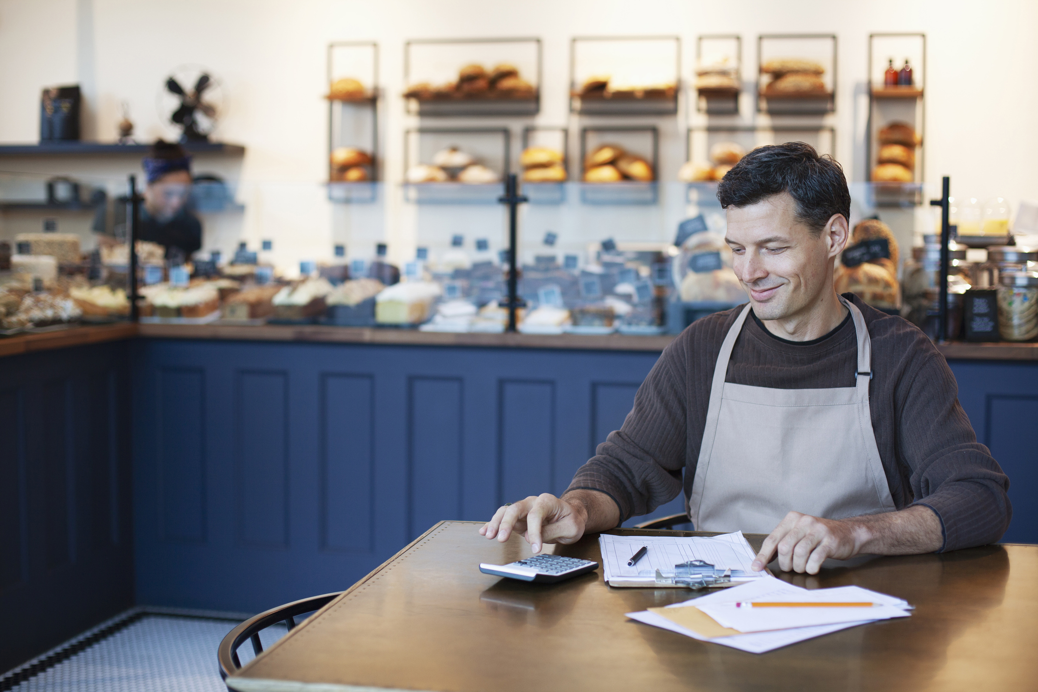 cafe owner at table